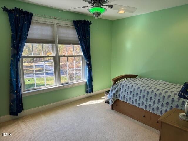 bedroom with light colored carpet and ceiling fan