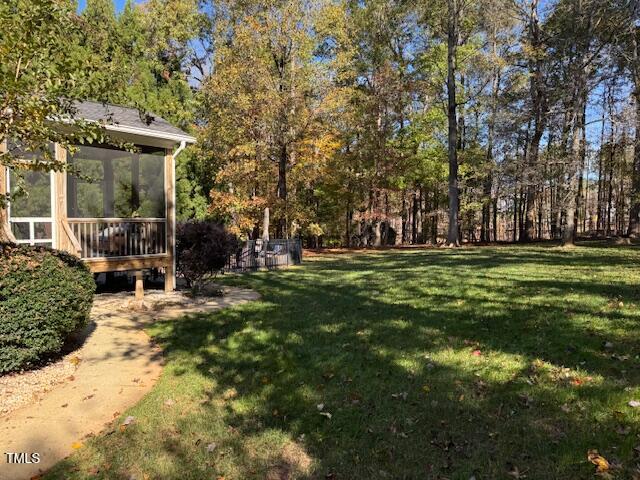 view of yard featuring a sunroom