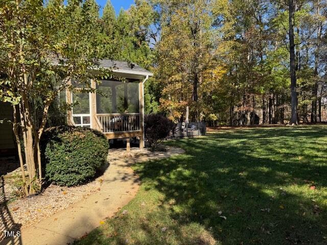 view of yard featuring a sunroom