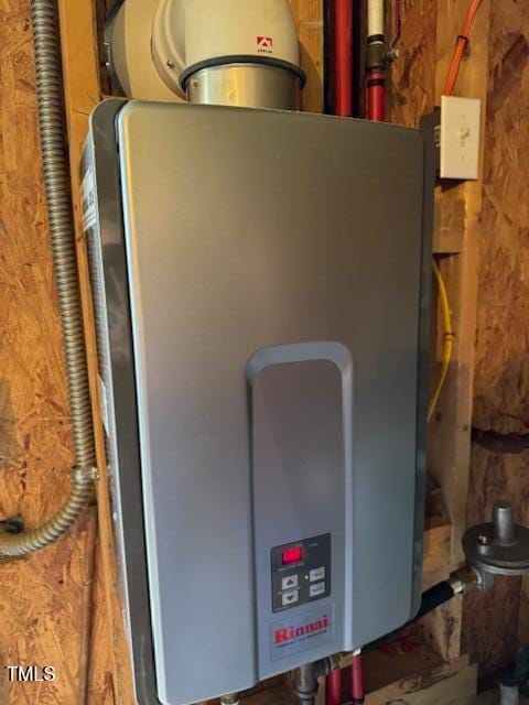 utility room with water heater