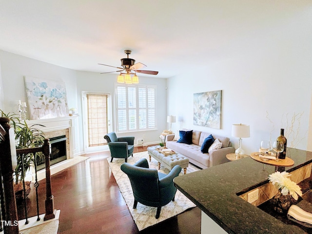 living room with hardwood / wood-style flooring and ceiling fan