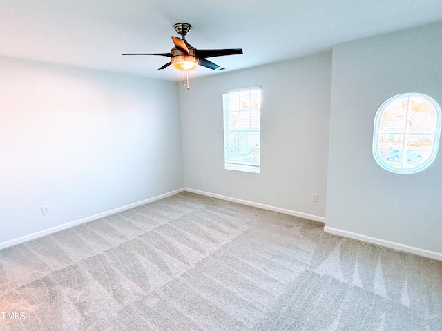 carpeted empty room with ceiling fan