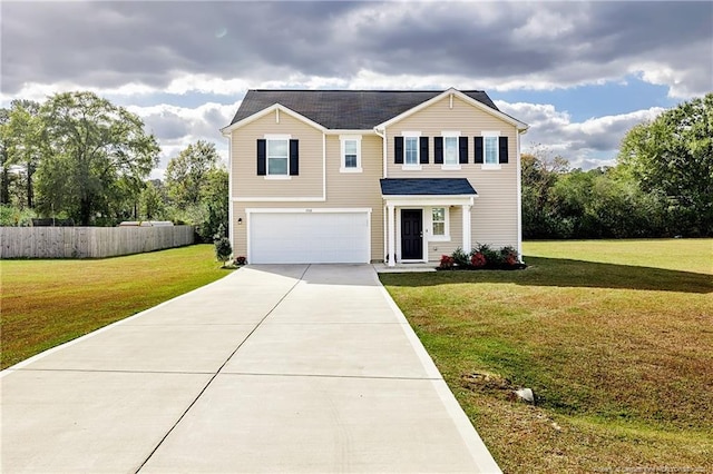 view of front of home with a garage and a front yard