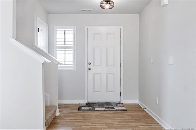 5918 Lowgrass Rd, Stedman, NC 28391 - entrance foyer with wood finished floors, baseboards, and stairs