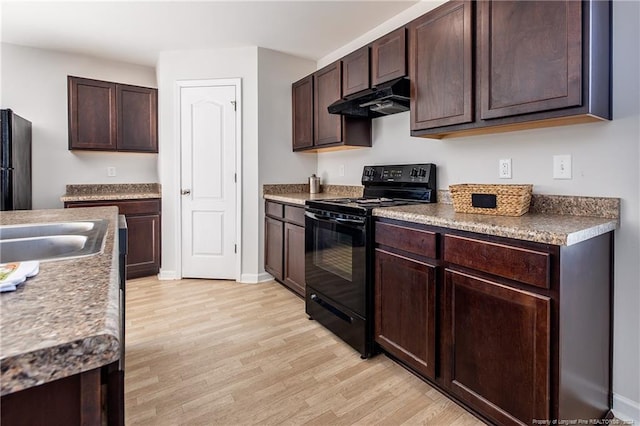 kitchen with stainless steel refrigerator, dark brown cabinets, black electric range oven, sink, and light hardwood / wood-style floors