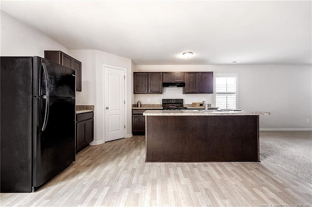 5918 Lowgrass Rd, Stedman, NC 28391 - kitchen with black appliances, ventilation hood, dark brown cabinetry, baseboards, and light wood finished floors