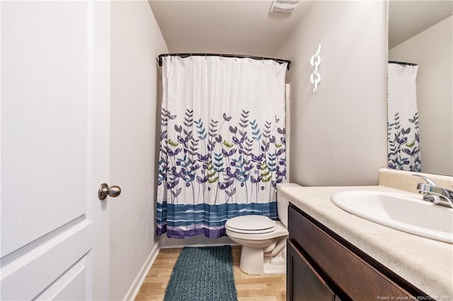5918 Lowgrass Rd, Stedman, NC 28391 - bathroom featuring vanity, wood finished floors, toilet, and curtained shower