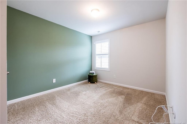 5918 Lowgrass Rd, Stedman, NC 28391 - spare room featuring carpet flooring and baseboards