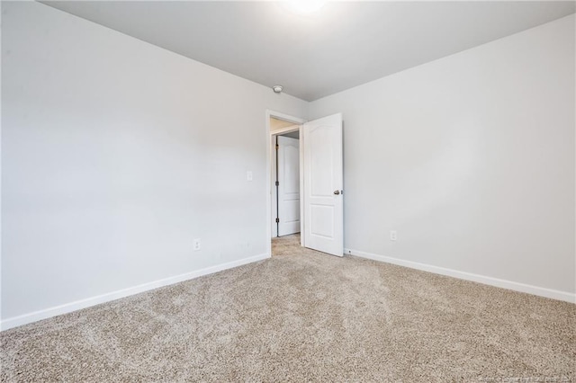 unfurnished room featuring carpet flooring