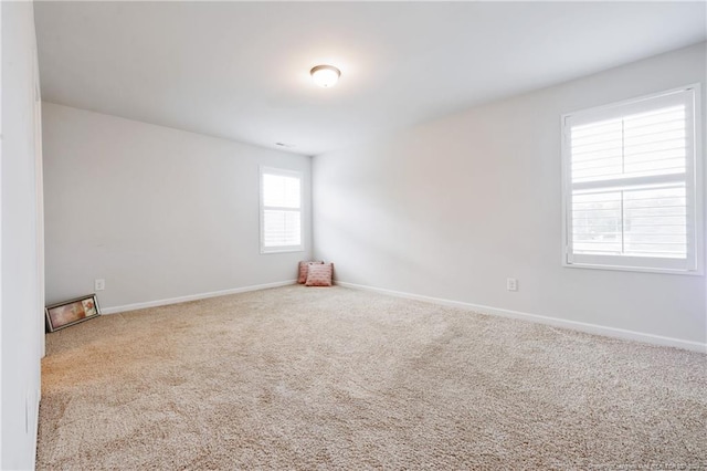 empty room featuring light carpet