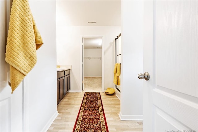 corridor featuring light wood-type flooring