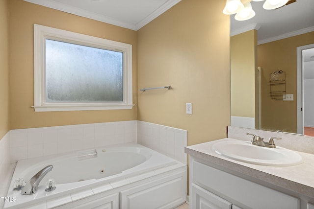 bathroom with vanity, a bathing tub, and crown molding