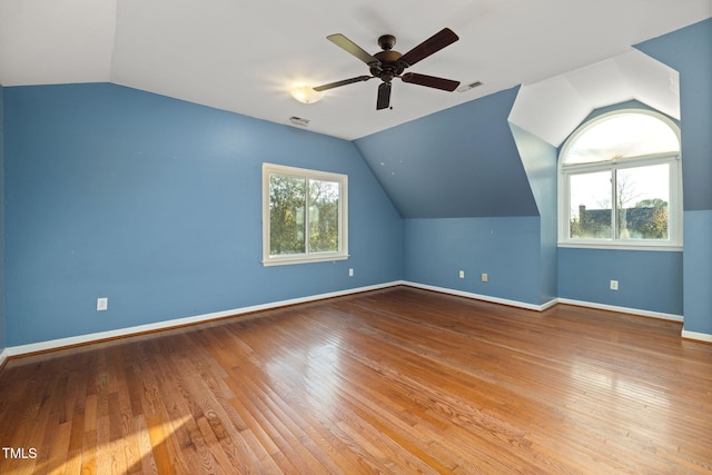 bonus room with ceiling fan, lofted ceiling, hardwood / wood-style flooring, and a healthy amount of sunlight