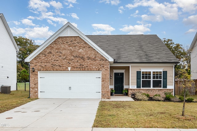 view of front of house featuring a front yard, cooling unit, and a garage