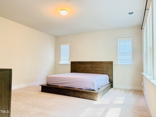 unfurnished bedroom with light carpet