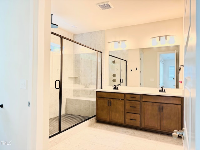 bathroom featuring vanity and a shower with shower door