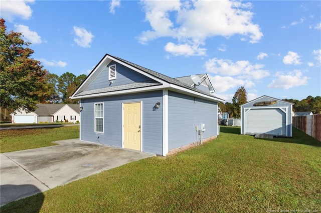 view of outbuilding featuring a lawn