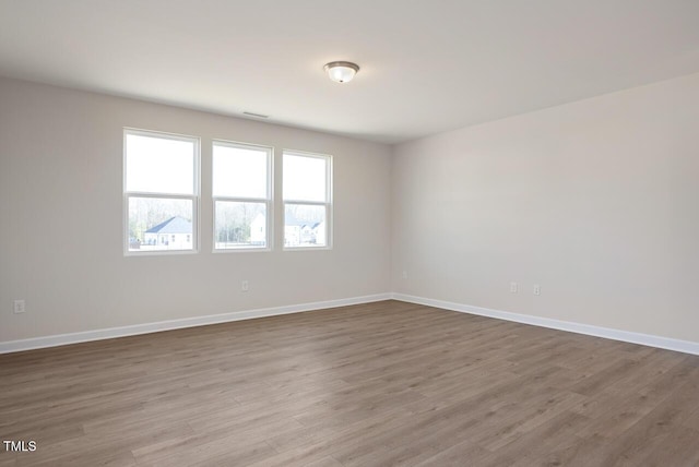 spare room featuring hardwood / wood-style floors