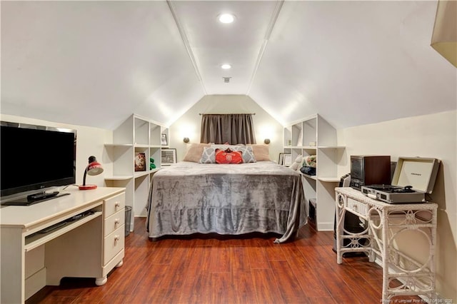 bedroom with lofted ceiling and dark wood-type flooring