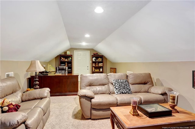 carpeted living room featuring lofted ceiling