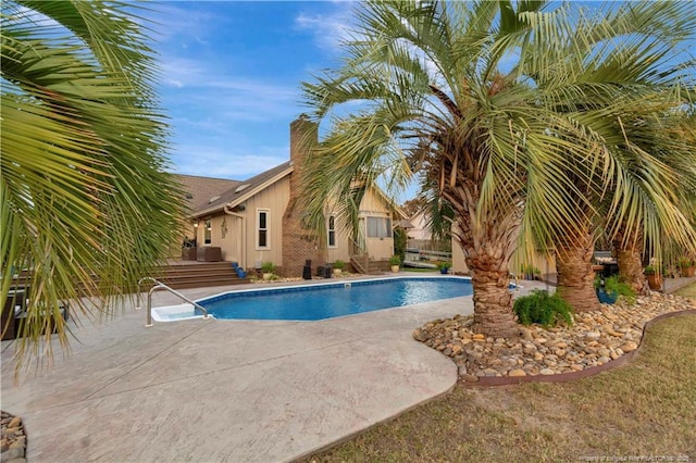 view of pool featuring a patio