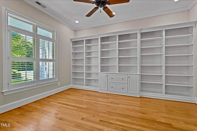 spare room featuring ceiling fan, crown molding, and light hardwood / wood-style flooring