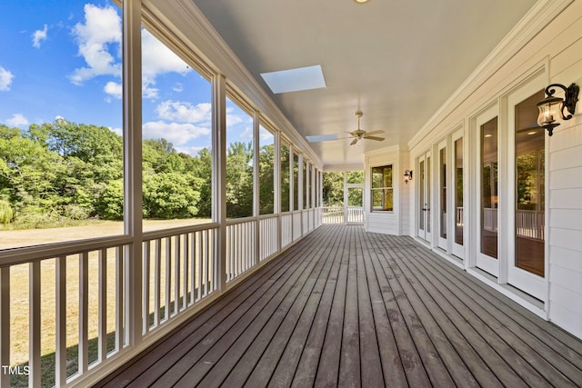 deck with french doors and ceiling fan