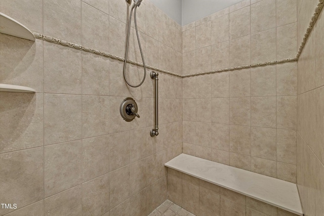 bathroom with a tile shower