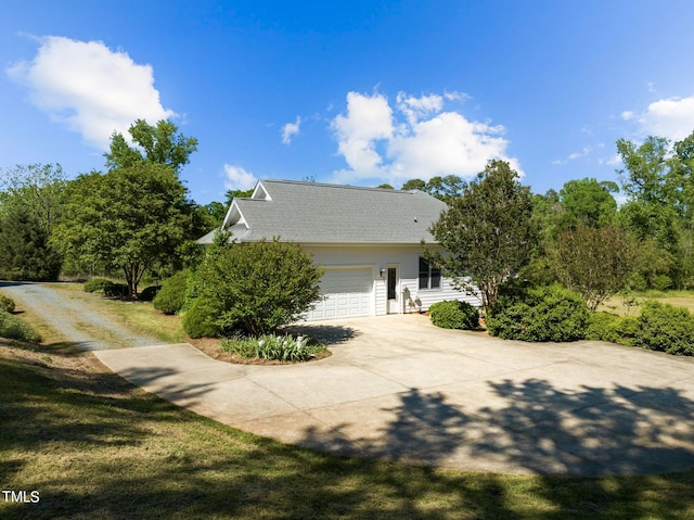 view of side of property with a garage