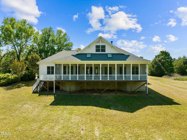 rear view of property with a lawn