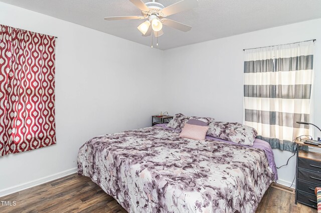 1717 Martin Luther King Dr, Rocky Mount, NC 27801 - bedroom with wood finished floors, baseboards, and a ceiling fan