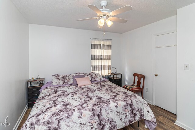 1717 Martin Luther King Dr, Rocky Mount, NC 27801 - bedroom featuring wood finished floors, baseboards, ceiling fan, and a textured ceiling