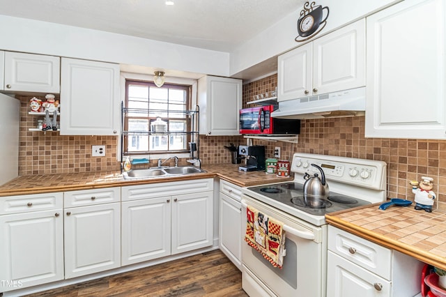 kitchen with white cabinets, white electric range oven, dark hardwood / wood-style flooring, and sink