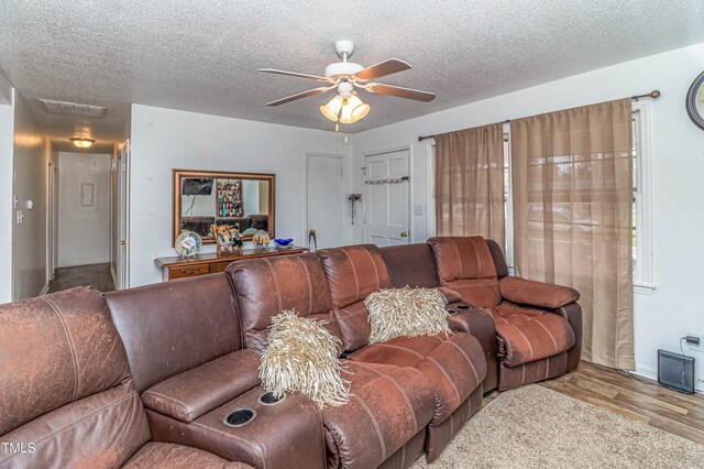 1717 Martin Luther King Dr, Rocky Mount, NC 27801 - living room with a ceiling fan, wood finished floors, a textured ceiling, and baseboards