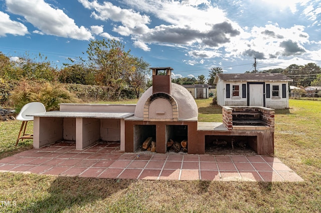 view of patio featuring an outdoor structure