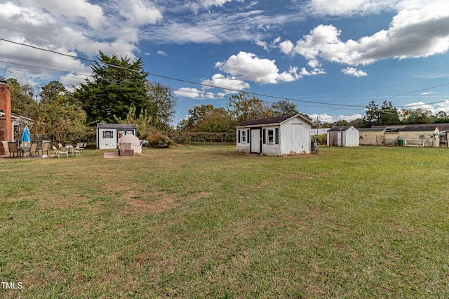 view of yard with a storage shed