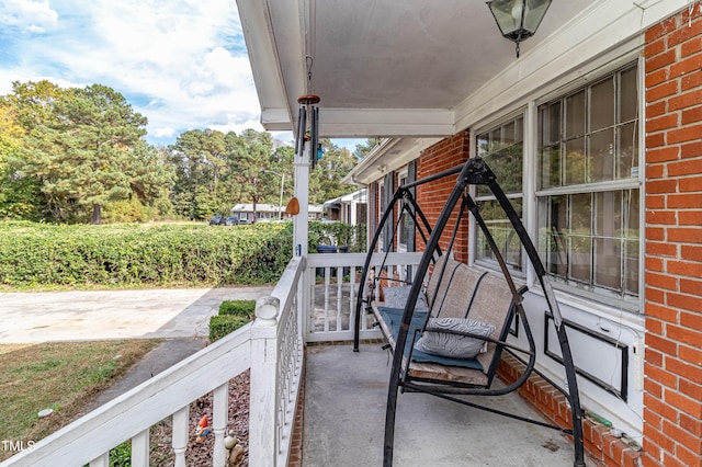 balcony featuring a porch