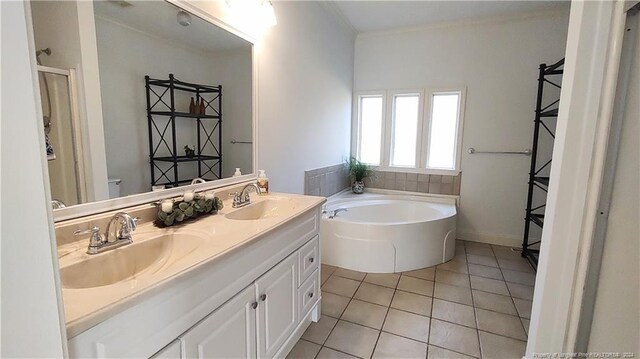 bathroom featuring vanity, tile patterned floors, and a bathing tub