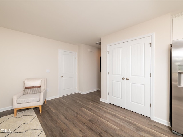 unfurnished room with dark hardwood / wood-style flooring