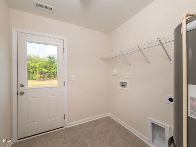 clothes washing area featuring hookup for an electric dryer, tile patterned flooring, water heater, and hookup for a washing machine