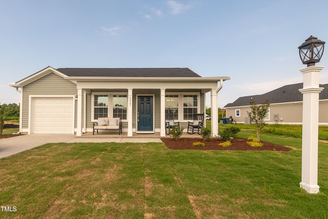 view of front of house featuring a garage, a porch, and a front lawn