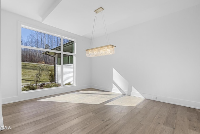 unfurnished dining area with light wood-type flooring