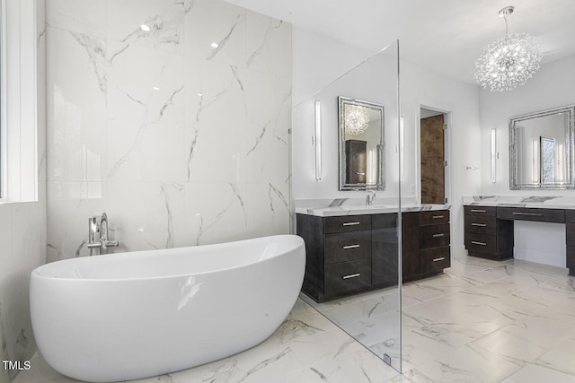 bathroom with a tub to relax in and vanity