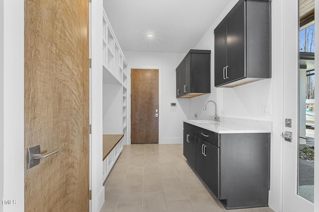 kitchen featuring sink and light tile patterned floors