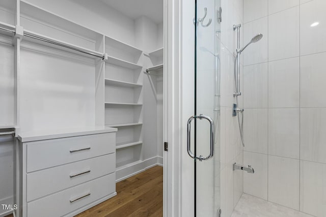 spacious closet with light hardwood / wood-style floors