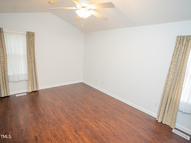 unfurnished room with dark wood-type flooring, ceiling fan, and vaulted ceiling