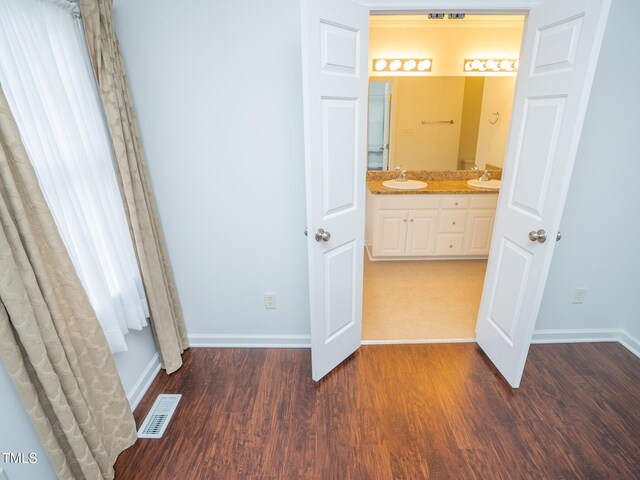 bathroom with vanity and hardwood / wood-style flooring