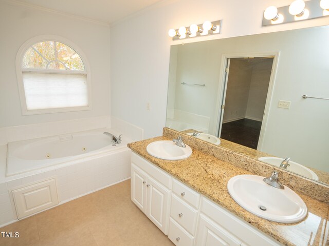 bathroom with tiled bath, tile patterned flooring, and vanity