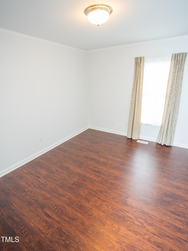 unfurnished room featuring dark hardwood / wood-style flooring and crown molding