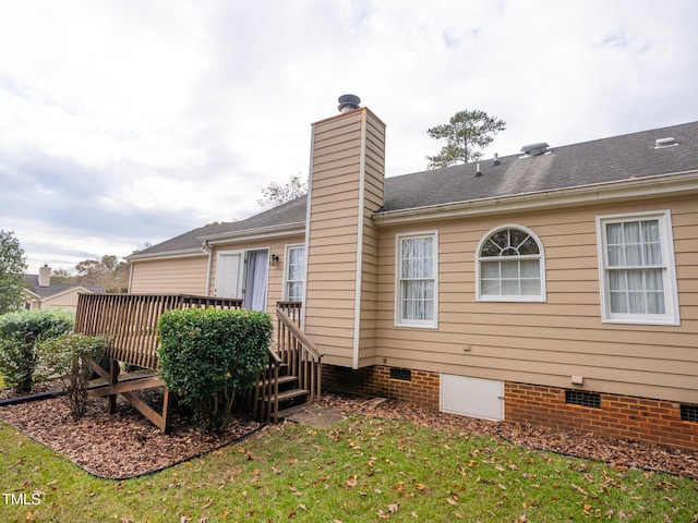 back of house featuring a yard